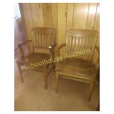 Two wooden chairs with arms solid