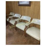 4 tan vinyl chairs with hammered tacks