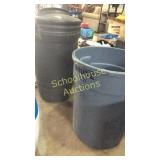 2 trash cans one with lid , inside gas can,