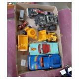 Box of cars and heavy equipment toys