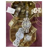 Box of fashion jewelry watches