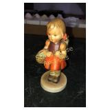 Hummel girl 5" tall. Chip on bottom of base