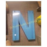 Blue Metal letter N sign.  About 24 inches