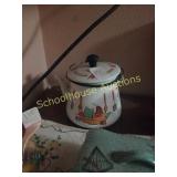 Enamel ware teapot with coin sleeves