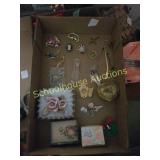 Flat of jewelry and brooches and boxes