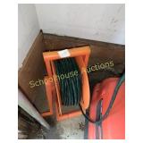 Green electrical extension cord on reel