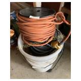 Bucket of power cords on reels