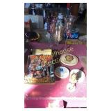 Assorted Hummels plus trio of glass decor/candle