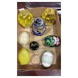 Flat of glass egg paperweights, black ceramic &