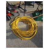 Large yellow heavy duty garden hose.