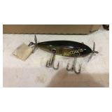 Green lure marked Injured Minnow