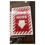 Metal fire hose sign. Mounts sideways so it