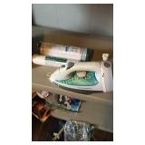 Hamilton beach iron, ironing board, and two water
