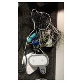 A mess of cellphone chargers and accessories back