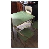 Green card table with 4 matching chairs.