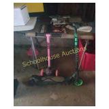 Pair of scooter. 1 electric scooter and one pink