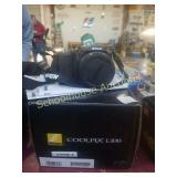 Nikon coolpix L100 with box and books