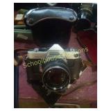 Minolta SR-7 camera with book