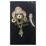 2 unique brass brooches
