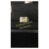 Large Silver ring. Not sure what markings are