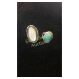 2 large rings. Mother of pearl unmarked,