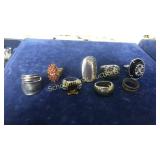 8 assorted ring lot. L to R: Japan stainless,