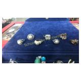 7 assorted pearl or yellow stone rings. First 2