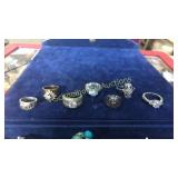 7 assorted rings. L to R: elephant is  925, 14k