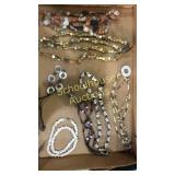 Flat of shell necklaces