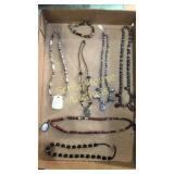 Flat of stone necklaces