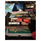 Red western train cars and white tankers with