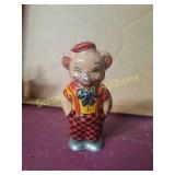 Tin wind pig toy.  Unavailable to read marker.