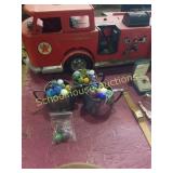 Silverplate dishes filled with marbles.