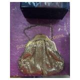Gold colored Whiting and Davis metal mesh purse