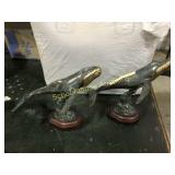 Pair of whale statues brass bellies wood base