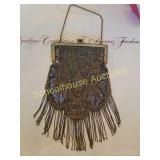 Awesome antique beaded purse with fringe. Slight