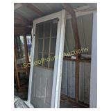 A screen door and two exterior doors believed to