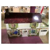 Large tin dollhouse with plastic furniture