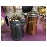 2 metal tea/coffee pots. Silver has minor rust