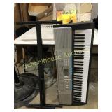 Casio LK-220 electric keyboard with charger stand