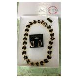Necklace & earrings set new in box. Black & gold