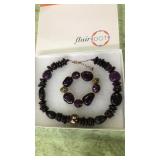 Necklace & earrings set new in box.  Purple &