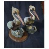 Porcelain Pelicans x2 both marked 1 on wood Stand