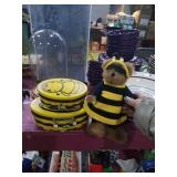 2 bee baskets and bear dressed as bee