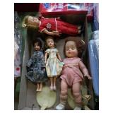 Group of 4 vintage dolls .