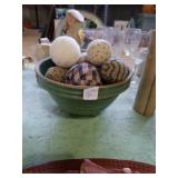 Green crock bowl with fabric balls
