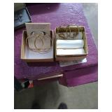 2 pairs of hoop earrings. 
1 pair marked 24