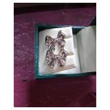 Sterling silver bow post earrings.