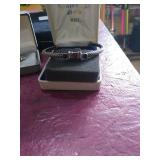 Unmarked Silver rope bangle with stone.