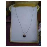 Sterling silver necklace with stone pendant.